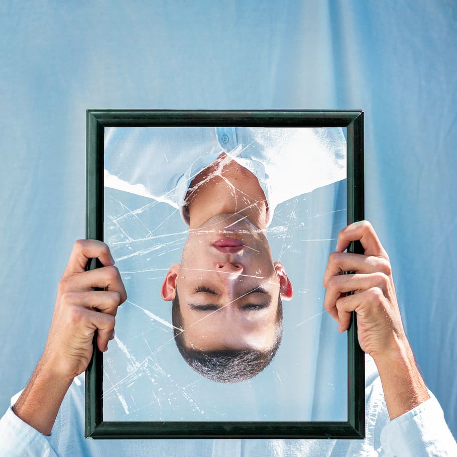 Man Closing His Eyes Reflection on Mirror, broken, conceptual
