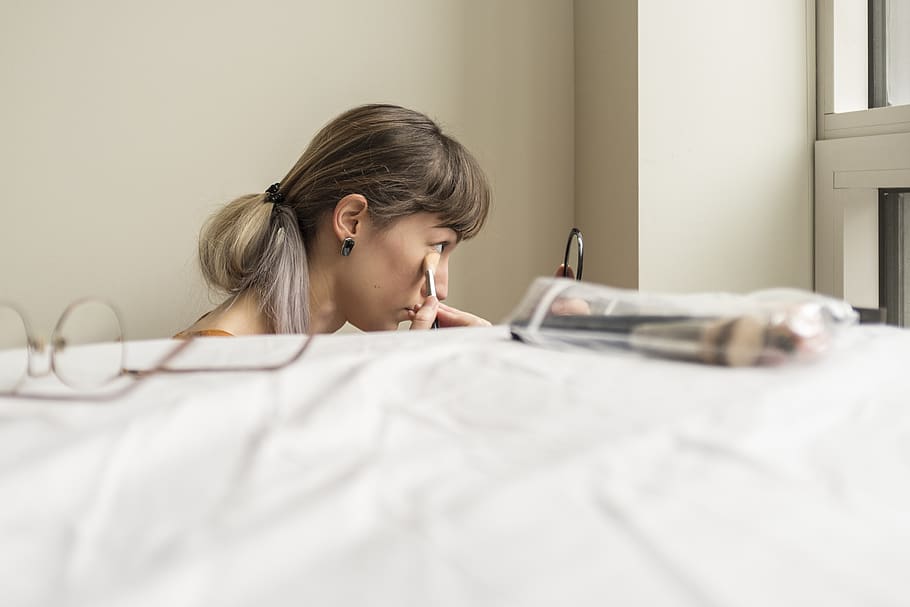 Hd Wallpaper Woman Putting Her Make Up While Sitting Near Bed