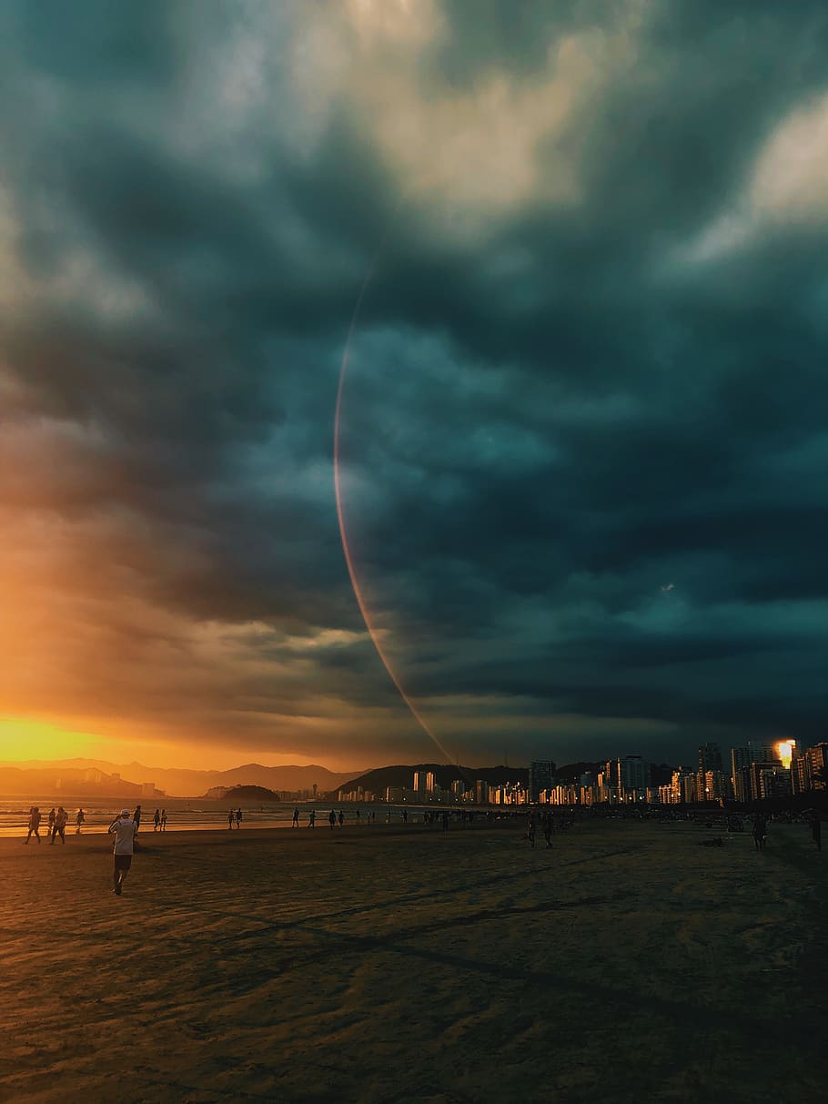 People Standing on Beachshore during Cloudy Sky, buildings, clouds HD wallpaper