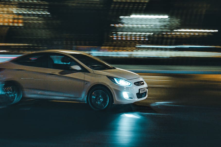 white Hyundai Accent on road during night time, transportation