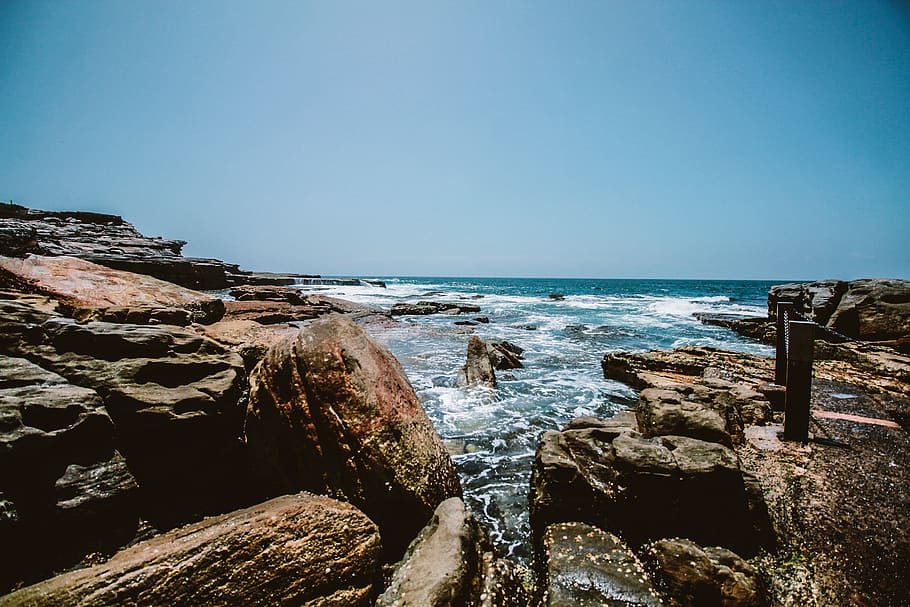 Rocks Near By The Ocean, beach, coast, daylight, rocky, scenic HD wallpaper
