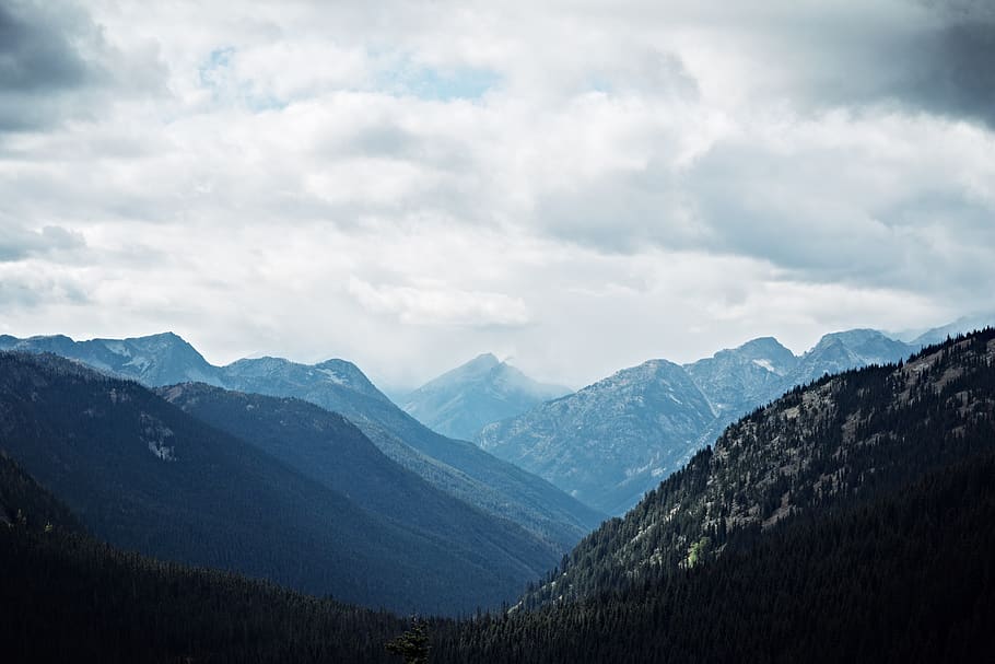 mountains under cloudy skies, landscape, landscape layers, mountain peak HD wallpaper