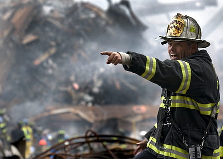 Fire Fighter Wearing Black and Yellow Uniform Pointing for Something HD wallpaper