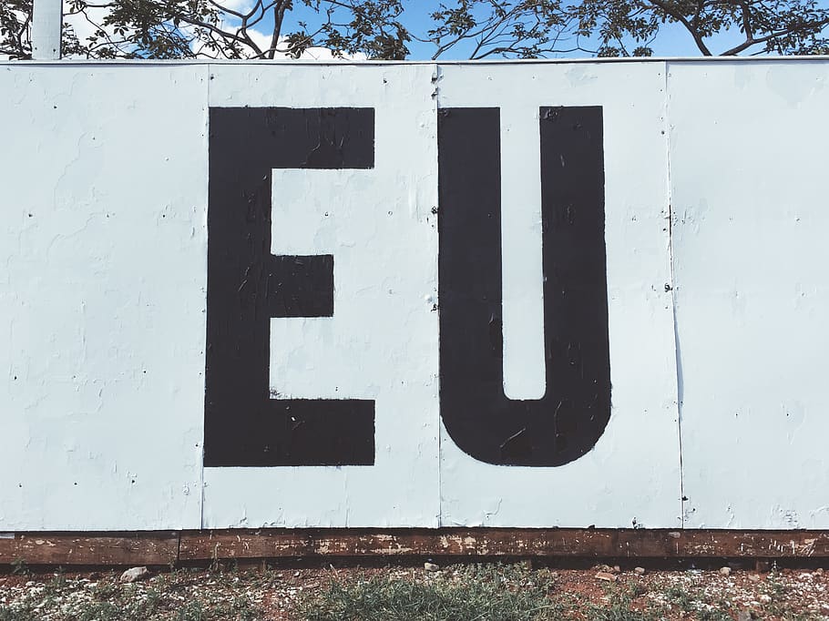 white and back EU painted wall during daytime, communication HD wallpaper