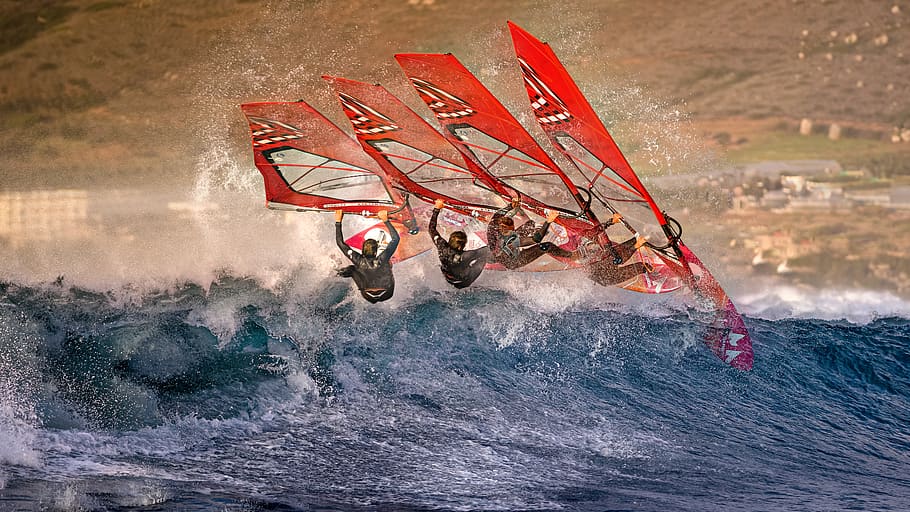 Continuous Shot of a Windsurfer Riding a Wave, action, exhilaration