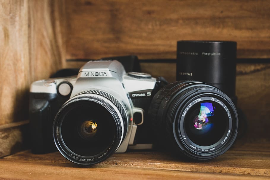 black Minolta camera beside black lens, electronics, film camera