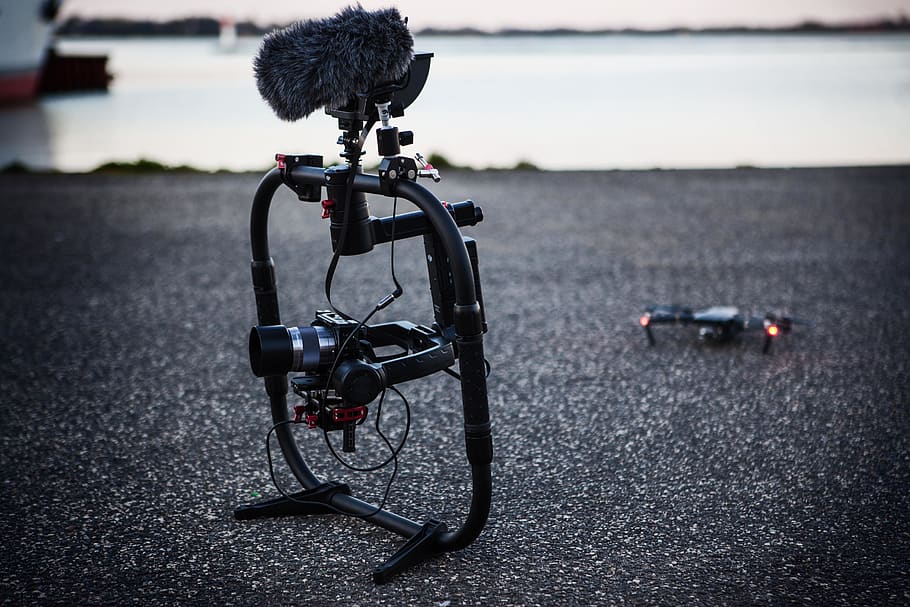 Shallow Focus Photography of Black Quadcopter Near Body of Water HD wallpaper