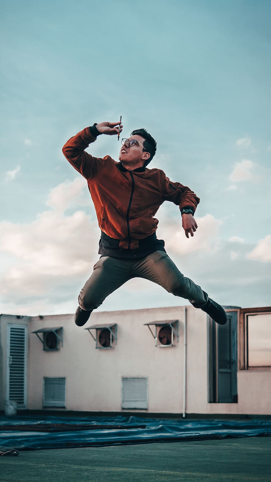 man jumping while holding pen, human, person, leisure activities HD wallpaper