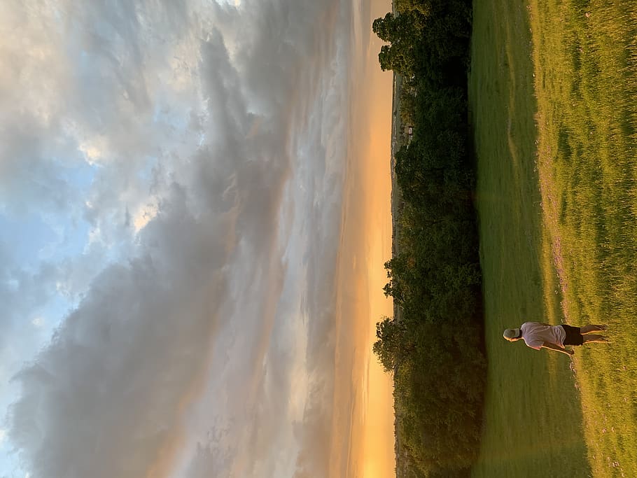 man standing on grass field, human, person, outdoors, nature HD wallpaper