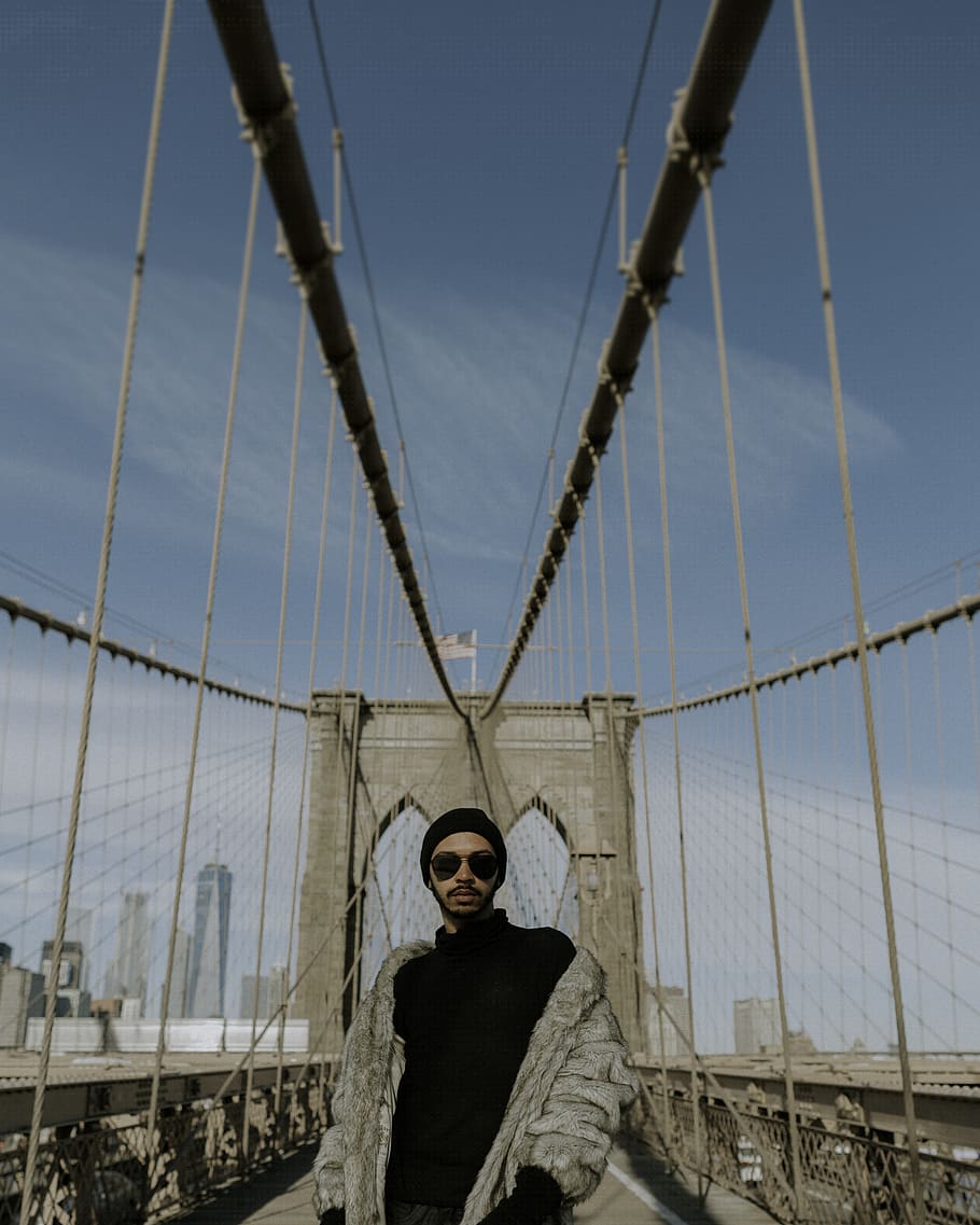 man standing between bridge during daytime, one person, architecture HD wallpaper
