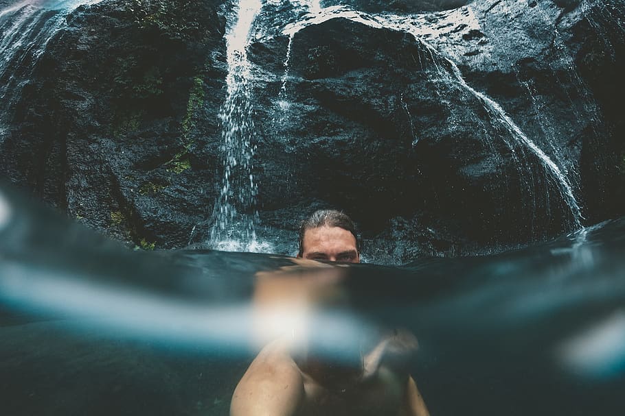 man talking a selfie half underwater in front of waterfalls, sports, HD wallpaper