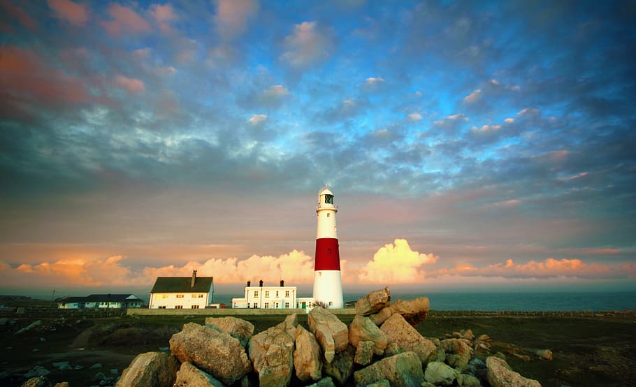 White and Red Lighthouse Near Rocks, architecture, beach, clouds HD wallpaper