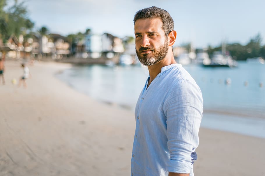 man standing on beach during daytime, one person, water, beard HD wallpaper