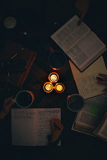 Top View Photo of People Writing On Notebook, candles, dark, fire HD wallpaper