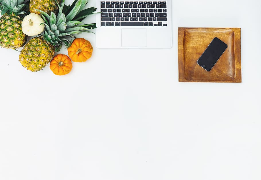 fruits near laptop on white surface, plant, pineapple, food, canada, HD wallpaper