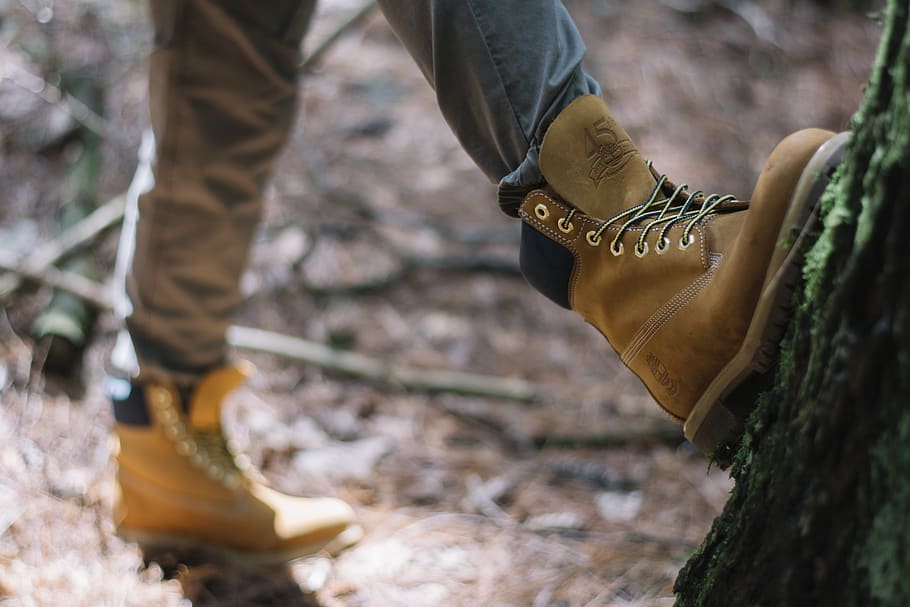person wearing brown Timberland nubuck work boots, clothing, apparel