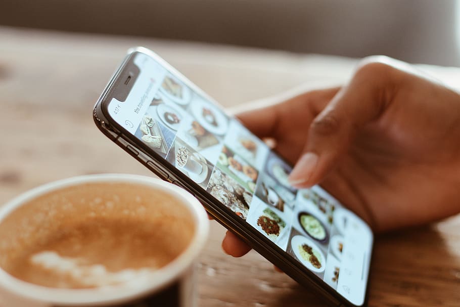 Selective Focus Photography of Person Using Iphone X, beverage HD wallpaper