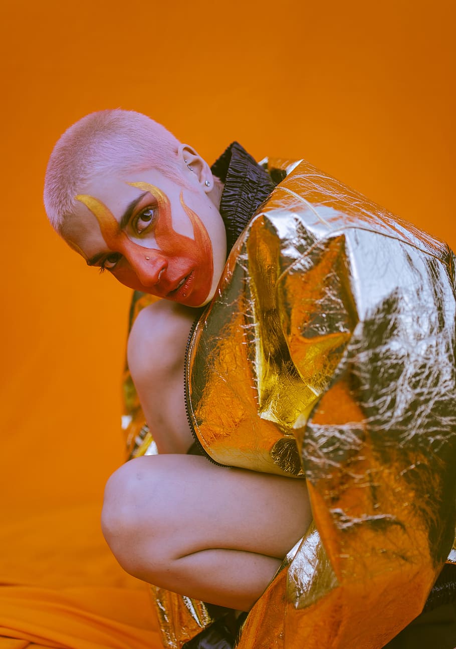 Woman Wearing Silver Zip-up Jacket Kneeling on Orange Textile HD wallpaper