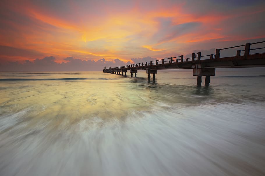 Brown Foot Bridge on Body of Water Under Orange Sky, beach, flow HD wallpaper