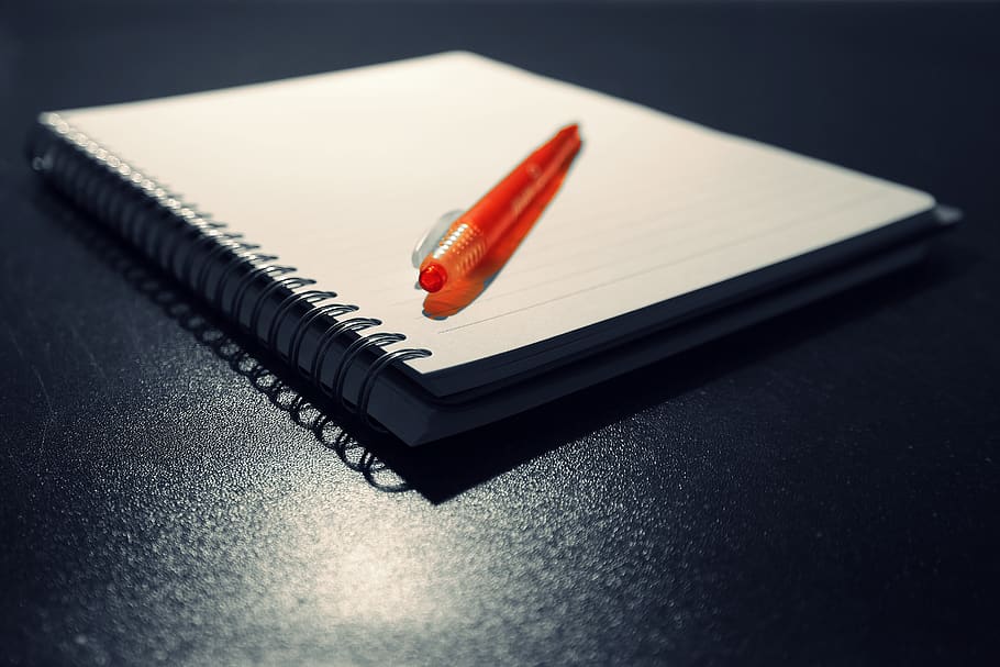 Orange Click Pen on Notebook, blank, blur, book bindings, desk HD wallpaper