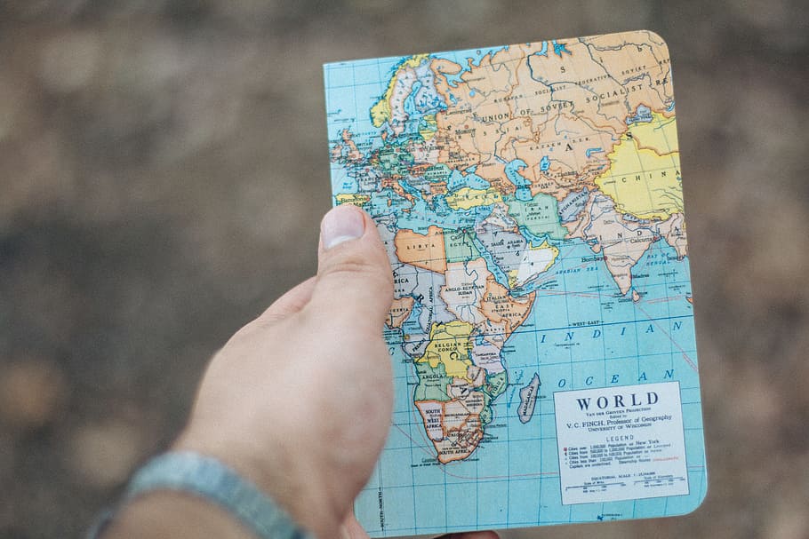 person holding world map, bokeh, blur, hand, interntional, asium HD wallpaper