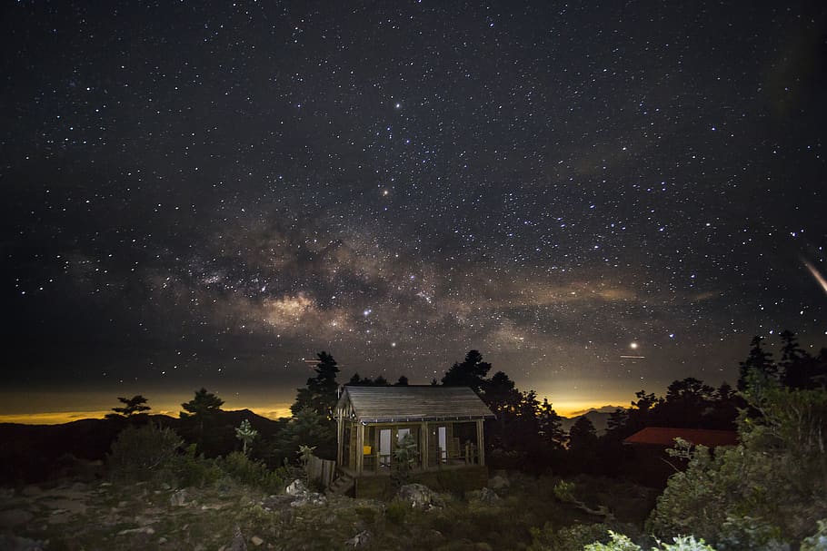 house surrounded by trees during nighttime, star - space, sky HD wallpaper