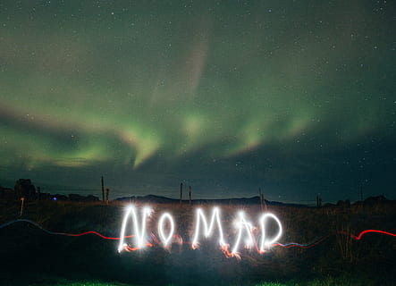 Light art with long shutter speed camera effects under Northern Lights HD wallpaper