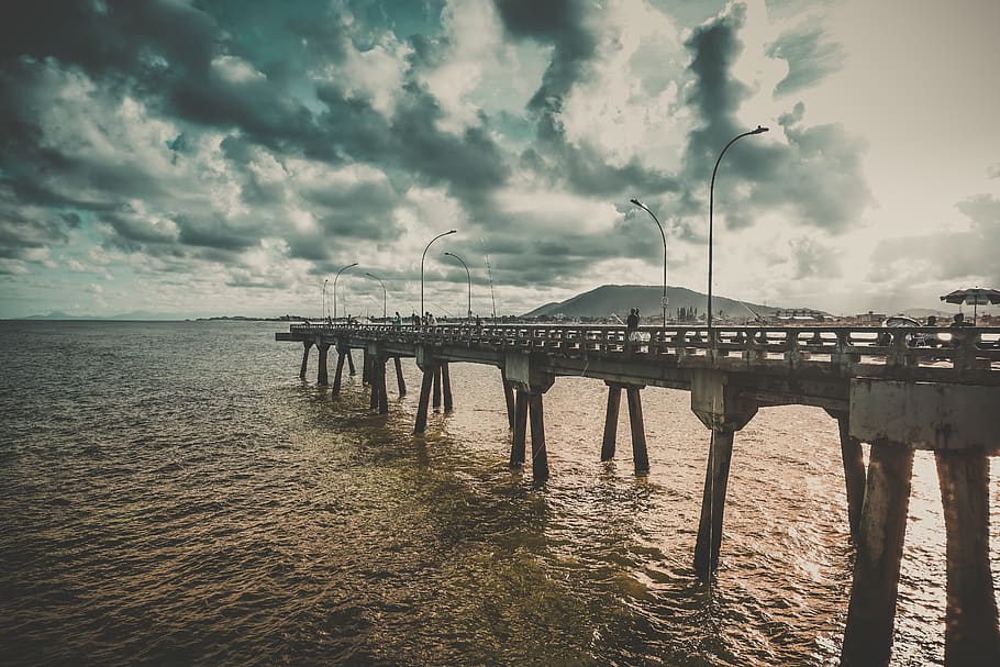 Bridge Surrounded by Water, beach, dark clouds, dawn, dock, evening HD wallpaper