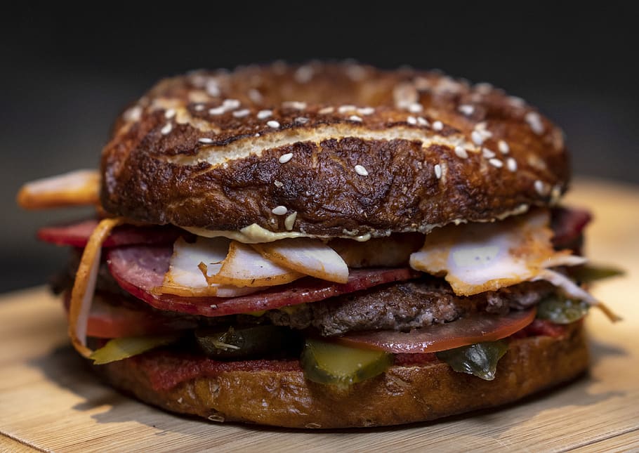 burger on brown surface, food, bread, bagel, pretzel, deli meat