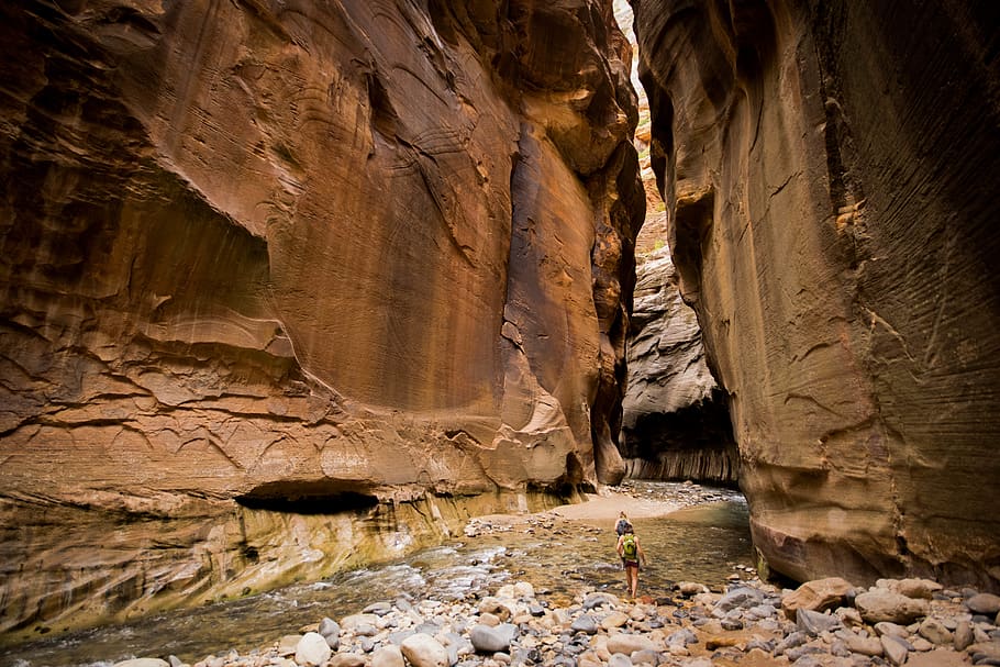 person between rocky mountain, cave, nature, the narrows, outdoors HD wallpaper