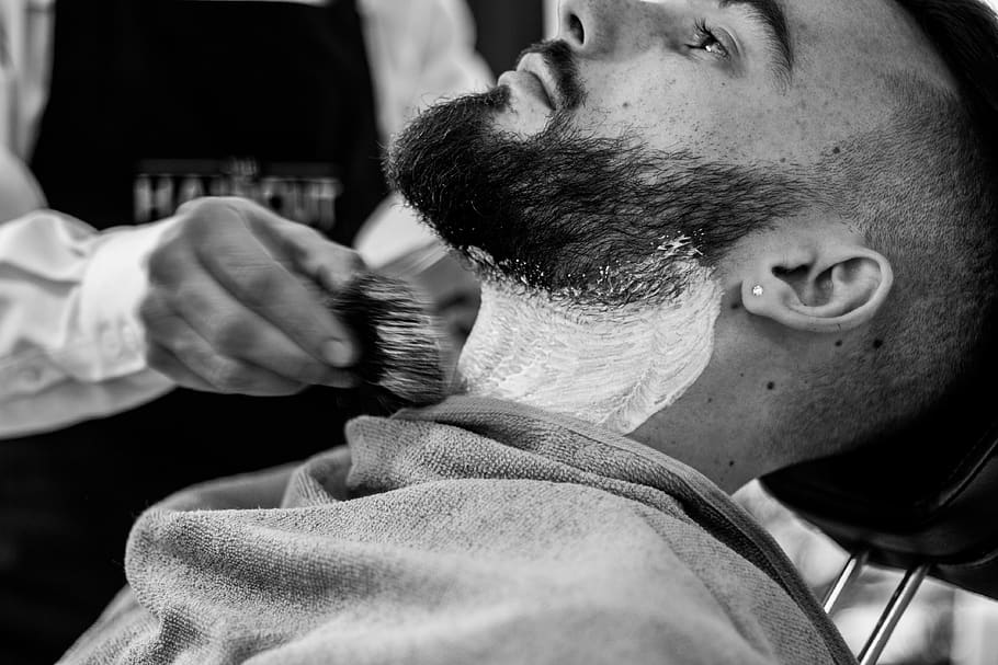 grayscale photo of man shaving his beard, men, real people, barber