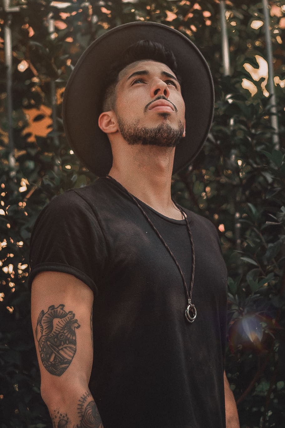 man standing behind grascreenshot, one person, young adult, hat HD wallpaper