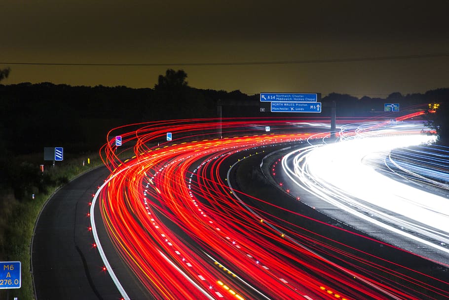 Time Lapse Photography of Car Passing by the Winding Road during Nighttime HD wallpaper