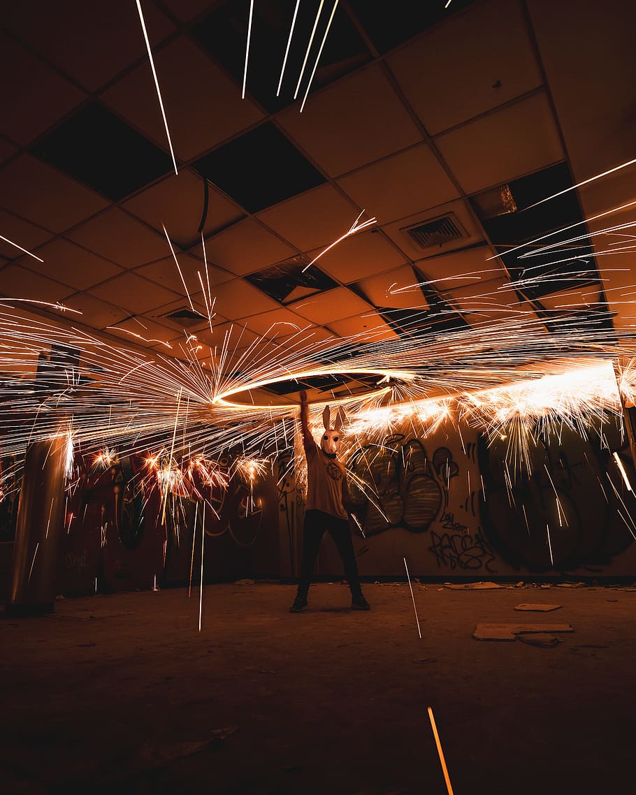 man holding steel wool in room, person, light, wire wool, light painting, HD wallpaper