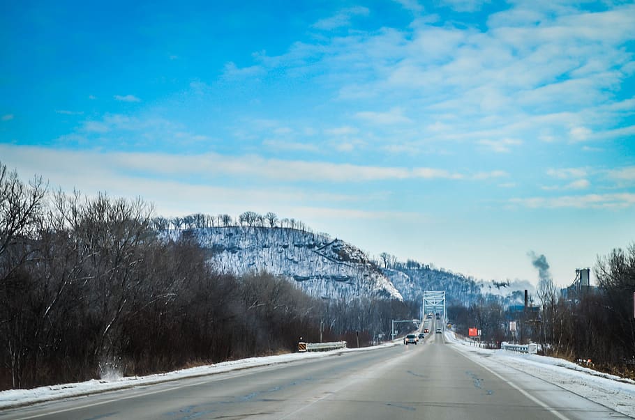 road, mountain, sky, snow, blue, dead trees, bridge, smoke HD wallpaper