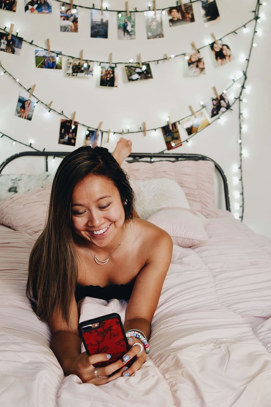 smiling woman lying bed while using smartphone, furniture, bedroom HD wallpaper