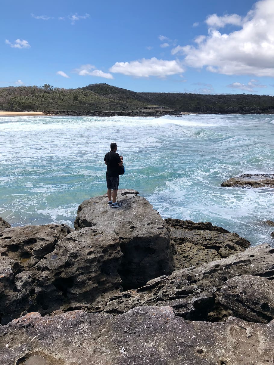 Photograph of Person on Cliff Facing Island at a Distant, beach HD wallpaper