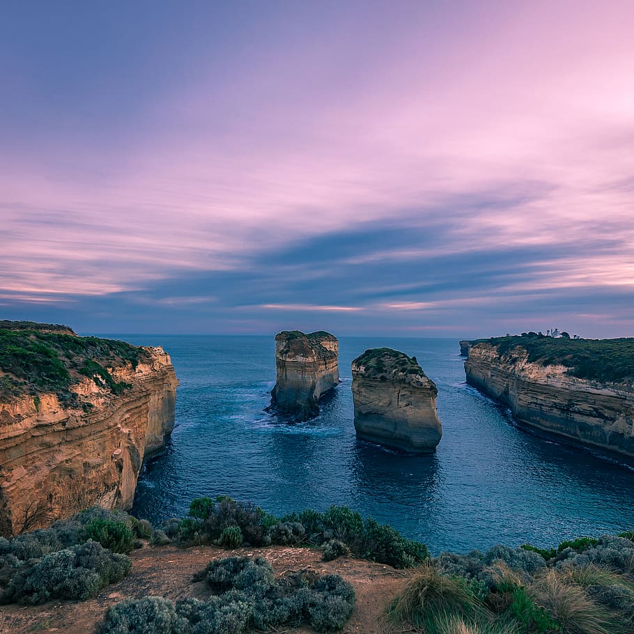Rock Formations on Water, beach, blue, cliff, clouds, dawn, landscape HD wallpaper