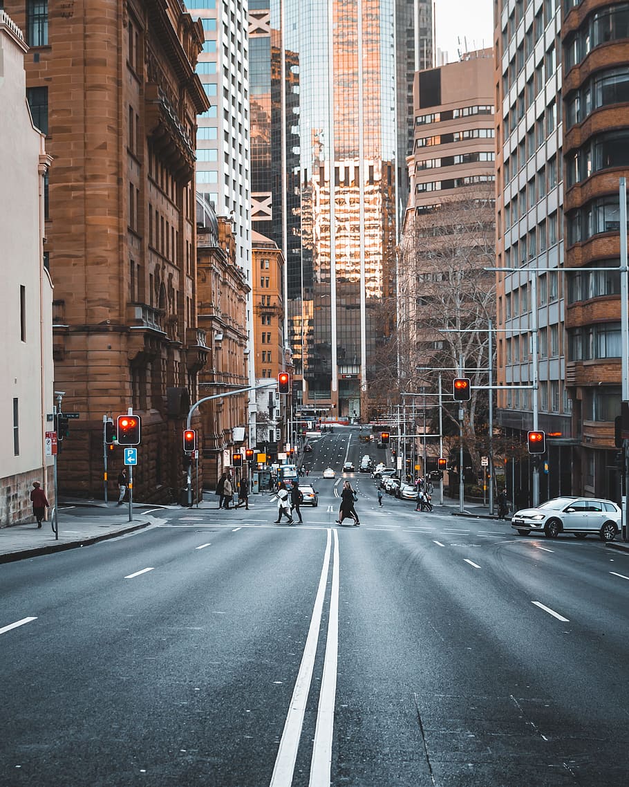 HD wallpaper: people crossing the street surrounded with high-rise buildings  | Wallpaper Flare