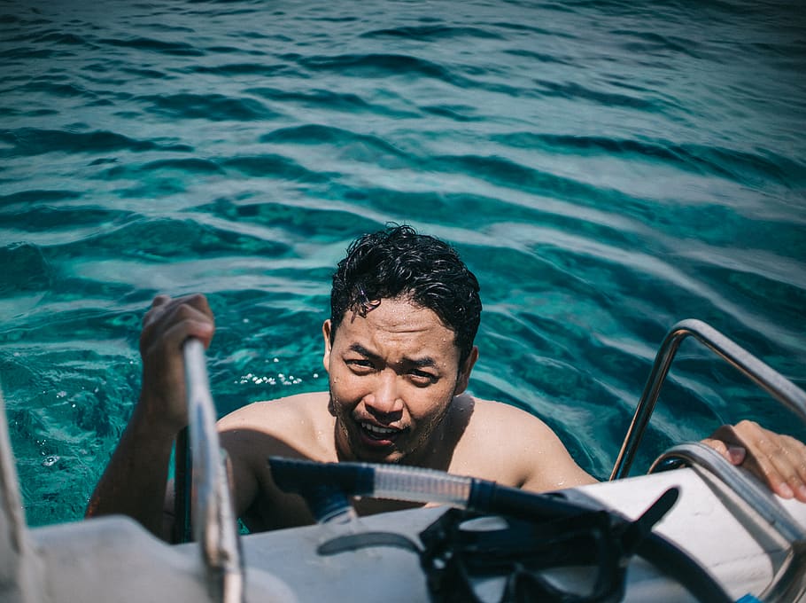 Man In A Body Of Water, beach, daylight, enjoyment, fun, handrails HD wallpaper
