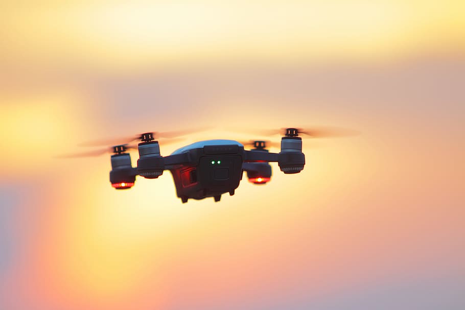 Black and Gray Dji Mavic Pro Drone Hovering at Golden Hour, backlit HD wallpaper