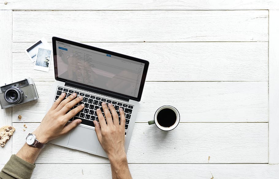 Person Using Tablet Computer Beside Mug and Camera, black coffee HD wallpaper