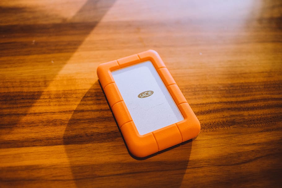 white and orange case on brown surface, wireless technology, communication HD wallpaper