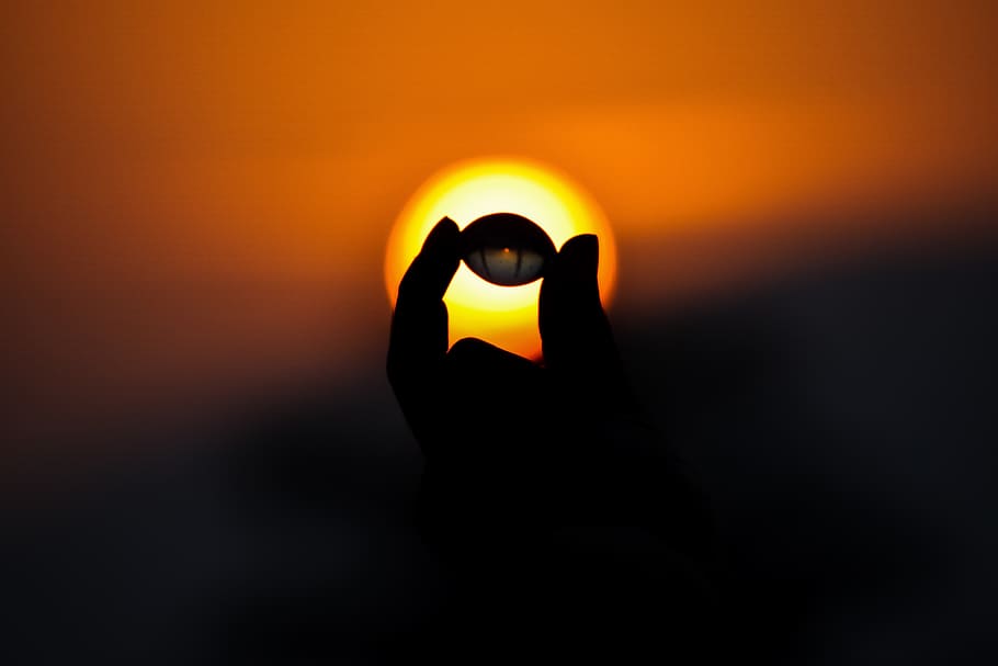 hand, small ball, sunlight, orange sky, silhouette, sunset HD wallpaper