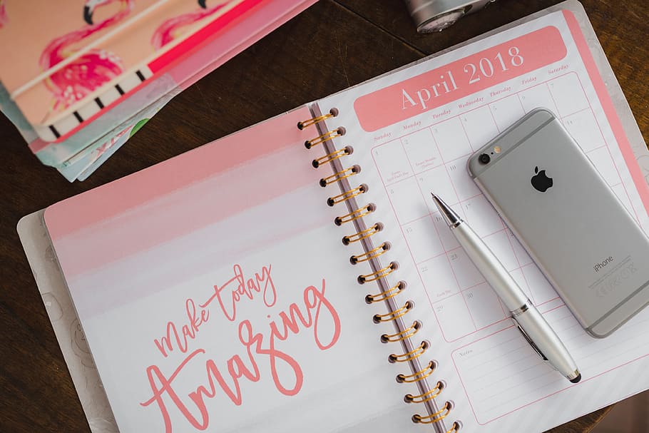 Pink calendar, notebook, diary, desk, note pad, pen, spiral notebook