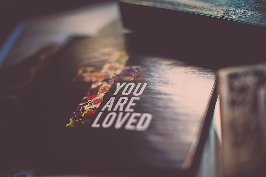 selective focus photography of You Are Loved book, cover, bokeh, HD wallpaper