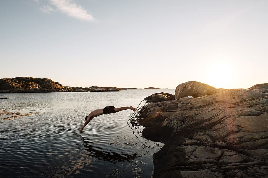 man diving on body of water, person, dive, sunset, sunrise, outdoors HD wallpaper