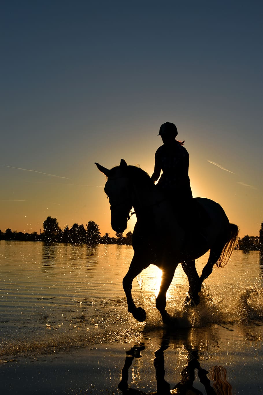 Silhouette of Person Riding Horse on Body of Water Under Yellow Sunset HD wallpaper