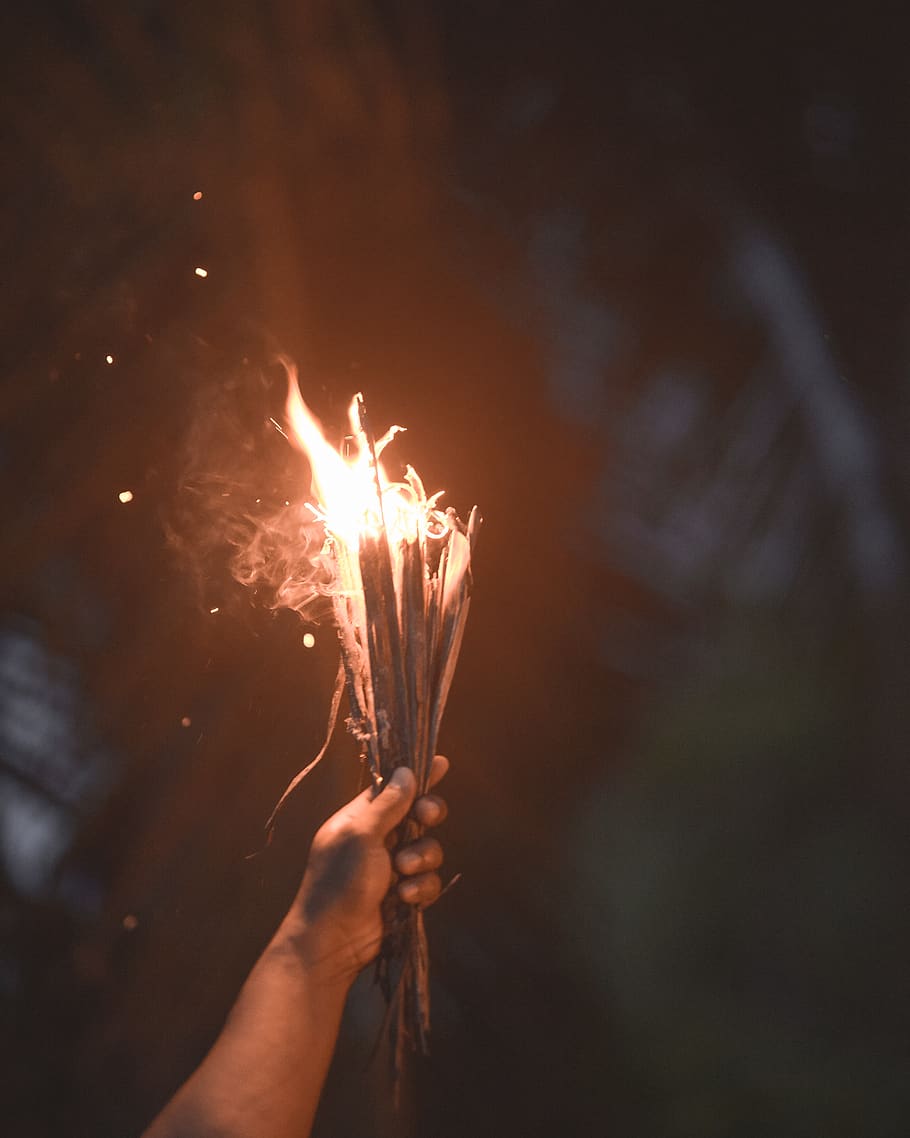 person holding burning sticks, fire, flame, burning wood, light