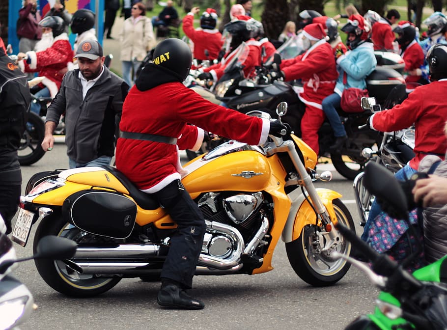 Person in Santa Suit Riding Yellow Cruiser Motorcycle, bikers